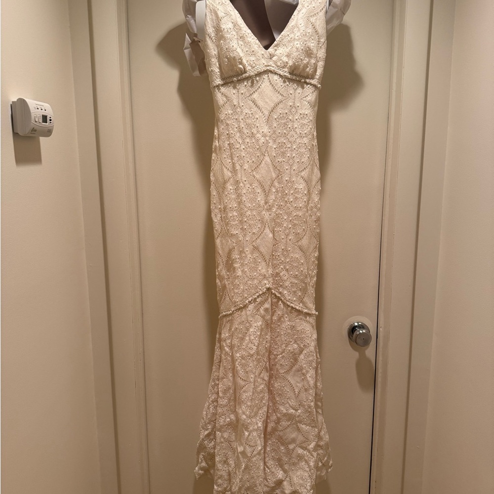 Claire Pettibone Chic Cream Lace Wedding Gown